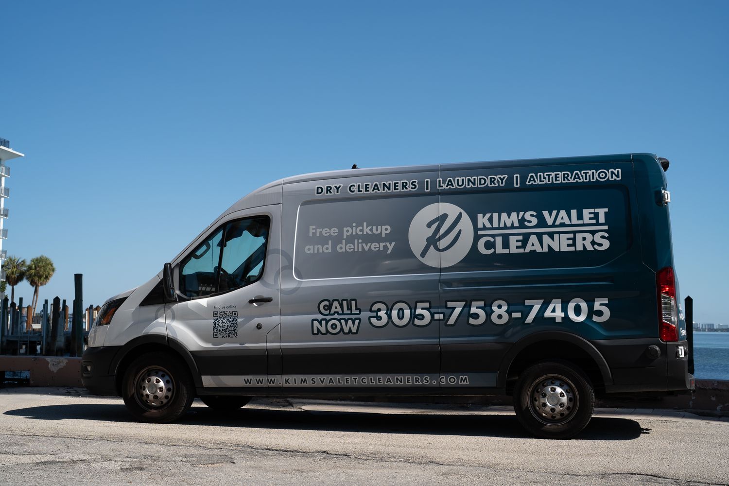 A Kim's Valet Cleaners van out on the route by Biscayne Bay